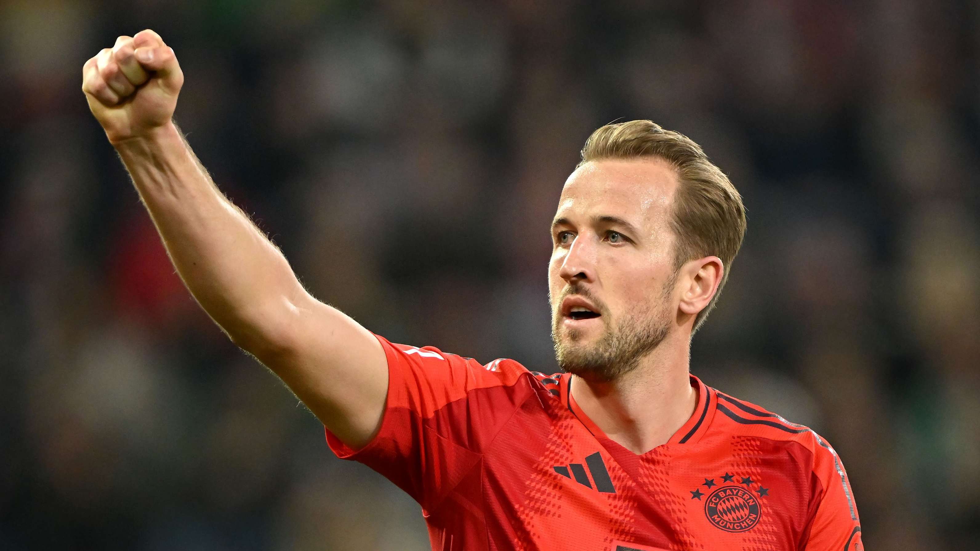 Kane fires Bayern one step closer to title against 10-man Augsburg  