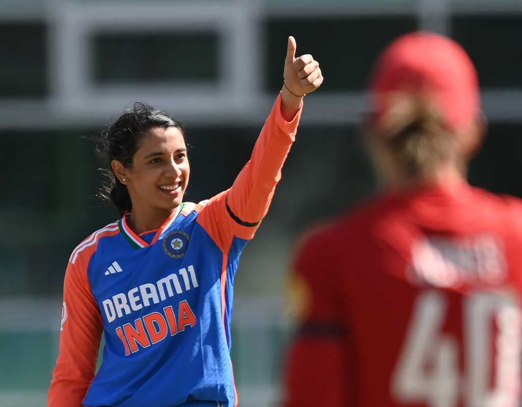 Mandhana's ton, Charani's four-fer headline India's thumping win  