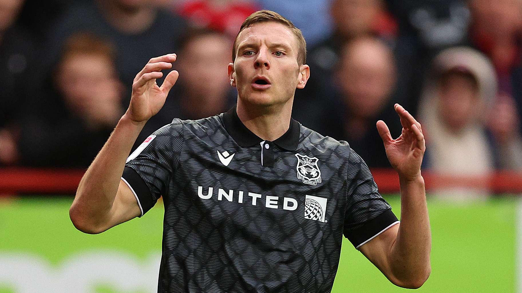 Mullin returns! Club legend back at Wrexham as Wigan loan cut short  