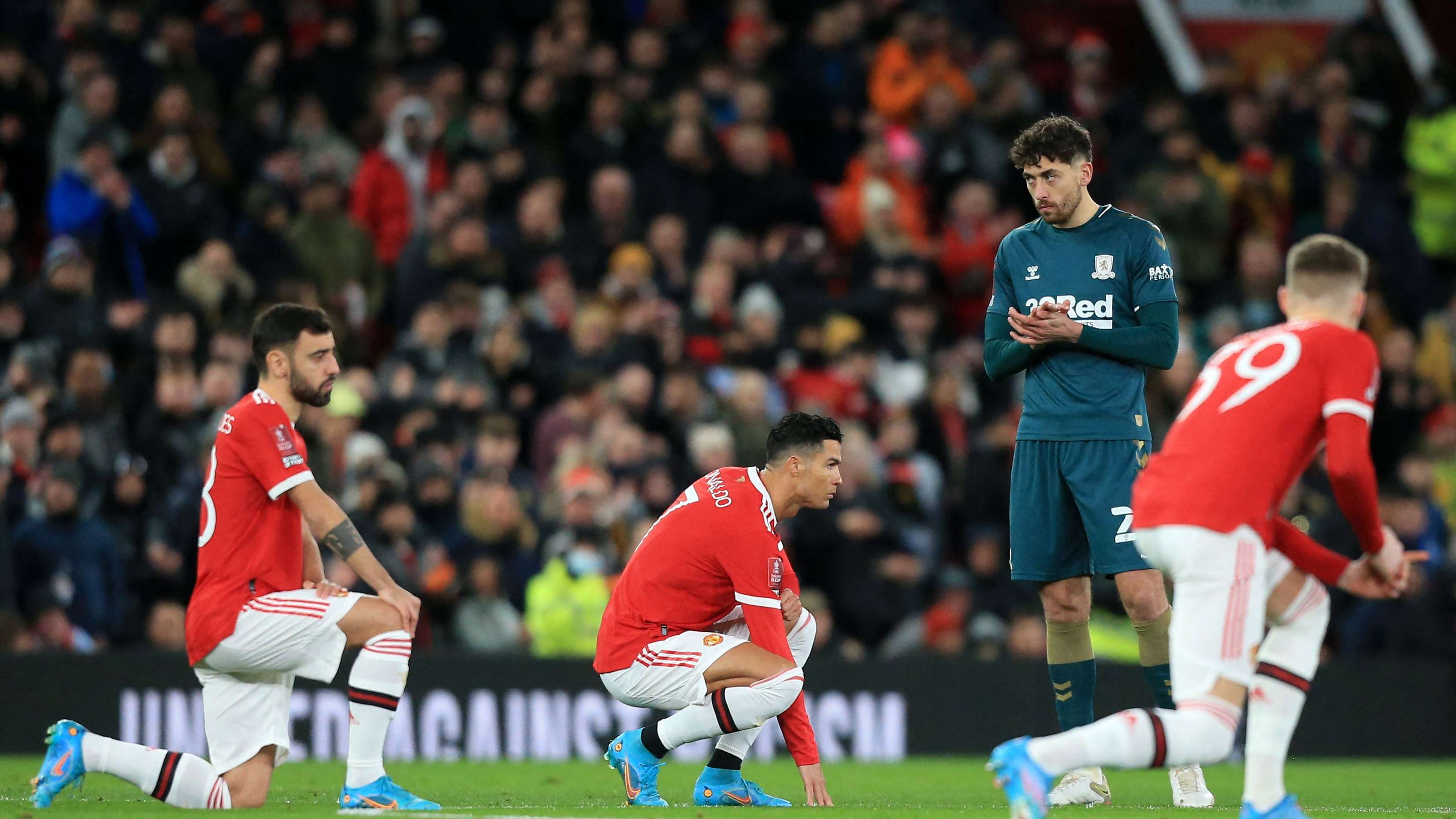 Why has England's striker stopped kneeling to fight racism?  